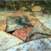 Lastre di marmo Greco scritto, alternate a quadrati Q3 resi in alternanze di colori, soprattutto in Cipollino e Portasanta